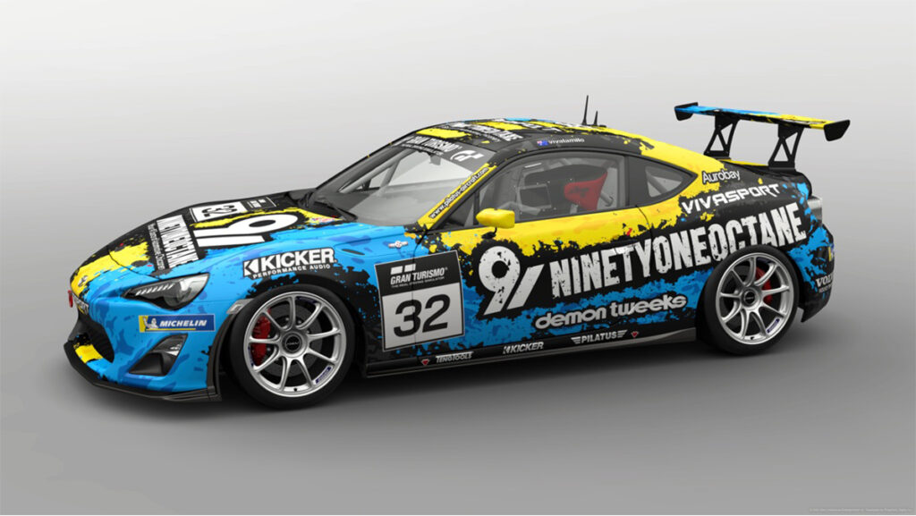 A custom-designed racing car livery in vibrant blue, yellow, and black with bold sponsor logos and the number 32, created in Gran Turismo. This digital art project is part of a creative homeschool curriculum that blends gaming with design and branding skills.
